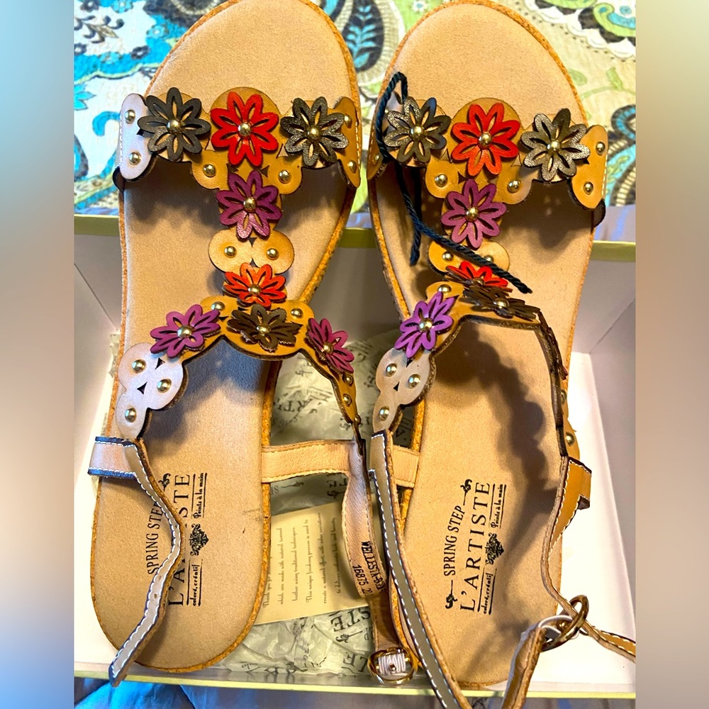 These brand new sandals are L’artiste brand.